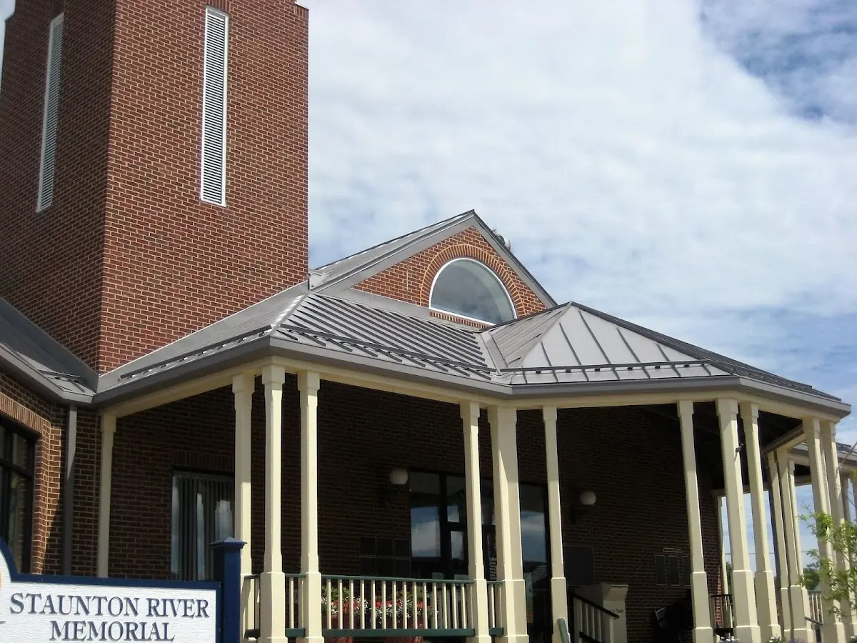 Skilled roofing craftsmen working on a residential roof in Deephaven